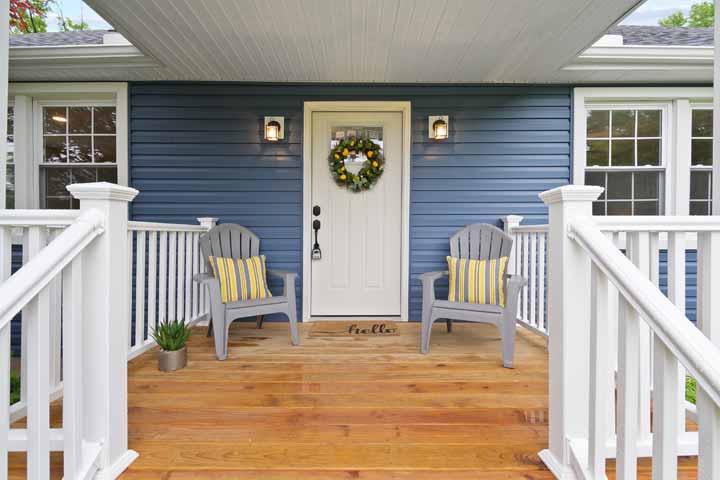 White door on blue siding house